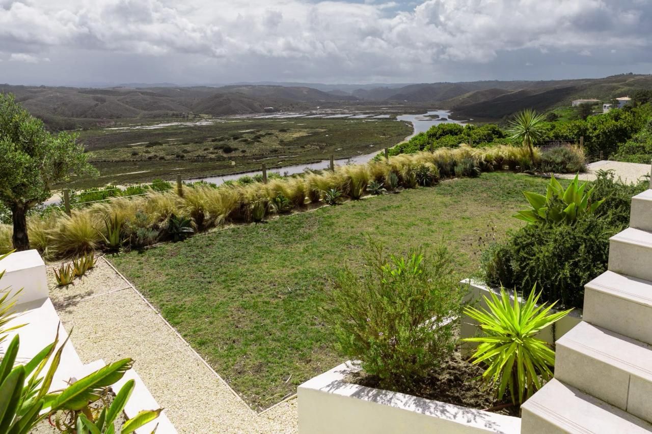 The finished garden with lawn and grasses above the estuary